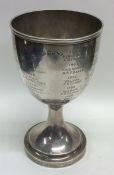 A heavy plain silver goblet. London. By Garrards.