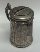 A Continental silver money box with engraved decor