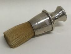 A novelty silver shaving brush with bristle end. A