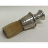 A novelty silver shaving brush with bristle end. A