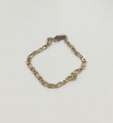 A 9 carat curb link bracelet with concealed clasp.