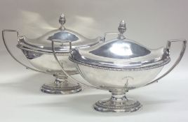 A good pair of Georgian silver sauce tureens and c