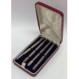 A cased set of four silver Bridge pencils with eng