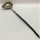 A Georgian silver toddy ladle with whale bone hand