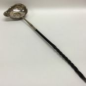 A Georgian silver toddy ladle with whale bone hand