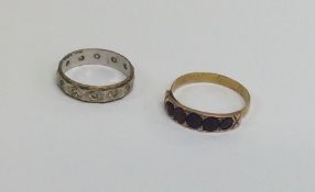 A 9 carat two colour gold eternity ring weighing a