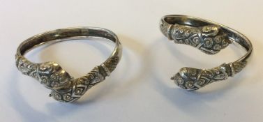 A pair of unusual Continental silver torque bangle