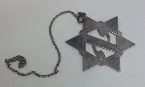 A large Hebrew pendant on suspension chain. Approx