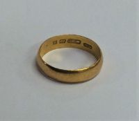 A 22 carat gold plain wedding band. Approx. 3.4 gr