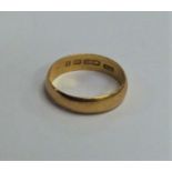 A 22 carat gold plain wedding band. Approx. 3.4 gr