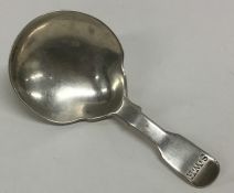 A heavy Georgian silver fiddle pattern caddy spoon