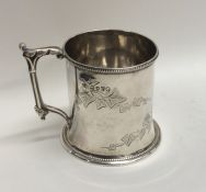 A Victorian silver christening cup decorated with