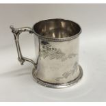 A Victorian silver christening cup decorated with