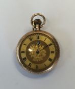 A 9 carat fob watch with gilt dial. Approx. 32 gra