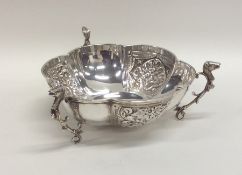 An Edwardian panelled silver bonbon dish decorated