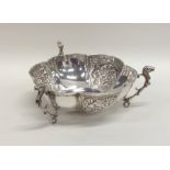 An Edwardian panelled silver bonbon dish decorated