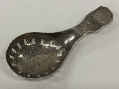 A Georgian silver bright cut caddy spoon with pier