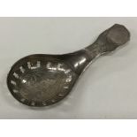 A Georgian silver bright cut caddy spoon with pier