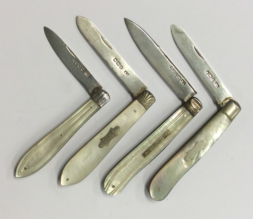 Four large silver and MOP fruit knives with reeded