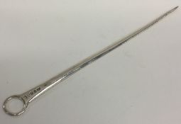 A long Georgian silver meat skewer with ring thumb
