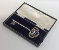 A massive silver and enamel key in fitted box. Bir