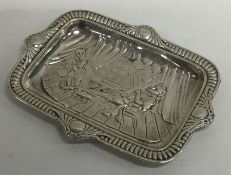 A small silver letter tray depicting Sir Walter Ra