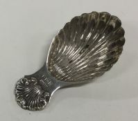 A heavy Edwardian cast silver caddy spoon with she