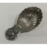 A heavy Edwardian cast silver caddy spoon with she
