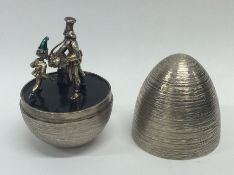 STUART DEVLIN: A cased silver egg of typical form