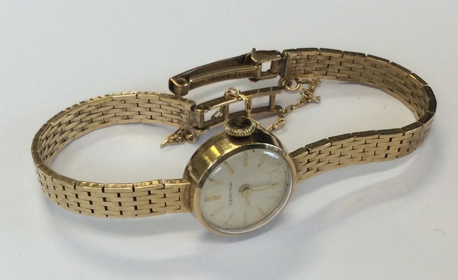 A lady's 9 carat wristwatch on mesh strap. Approx.