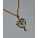 A 9 carat aquamarine pendant on fine link chain. A
