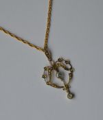 A 9 carat aquamarine pendant on fine link chain. A