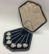 A stylish set of six bean top silver coffee spoons