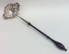 A Georgian silver double lip toddy ladle on turned