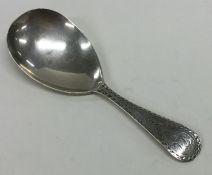 A Georgian silver bright cut caddy spoon decorated