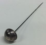 A Norwegian silver hatpin decorated with flowers a