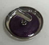 A circular silver and enamel cigarette holder. 925