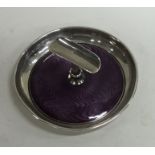 A circular silver and enamel cigarette holder. 925