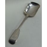 EXETER: A large silver fiddle pattern caddy scoop.