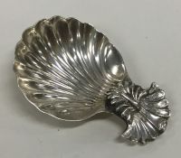 An unusual Georgian silver caddy spoon with fluted
