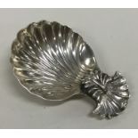 An unusual Georgian silver caddy spoon with fluted