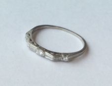 An unusual platinum and diamond half eternity ring