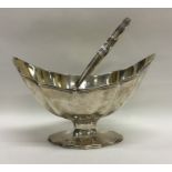 A good Georgian silver swing handled sugar basket