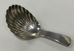 A good Georgian silver caddy spoon with fluted bow