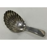 A good Georgian silver caddy spoon with fluted bow