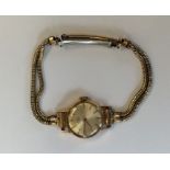 A lady's gold wristwatch on mesh strap. Approx. 14