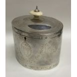 A good Georgian silver bright cut oval tea caddy w