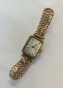 A lady's stainless steel Tissot wristwatch on 18 c