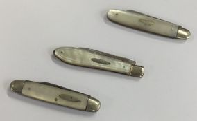 Two silver and MOP fruit knives together with anot