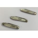 Two silver and MOP fruit knives together with anot